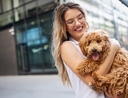 Woman deciding if pet insurance is worth the cost